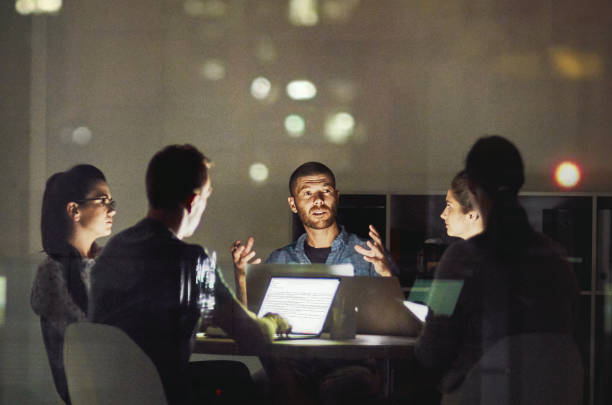 Shot of creative employees working late in the office
